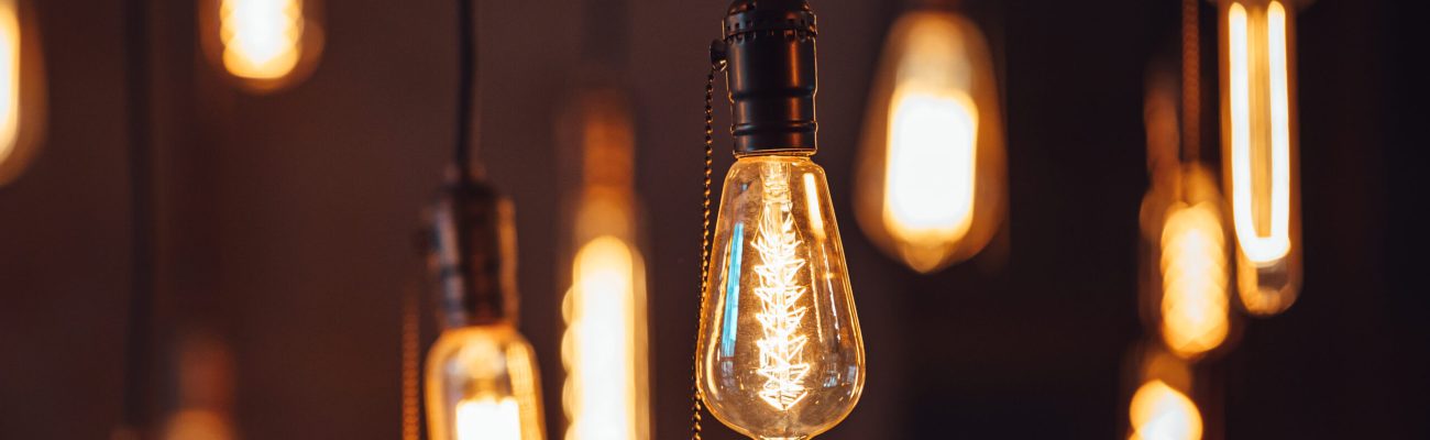 Bright retro lamps hanging on the ceiling of a modern house or cafe